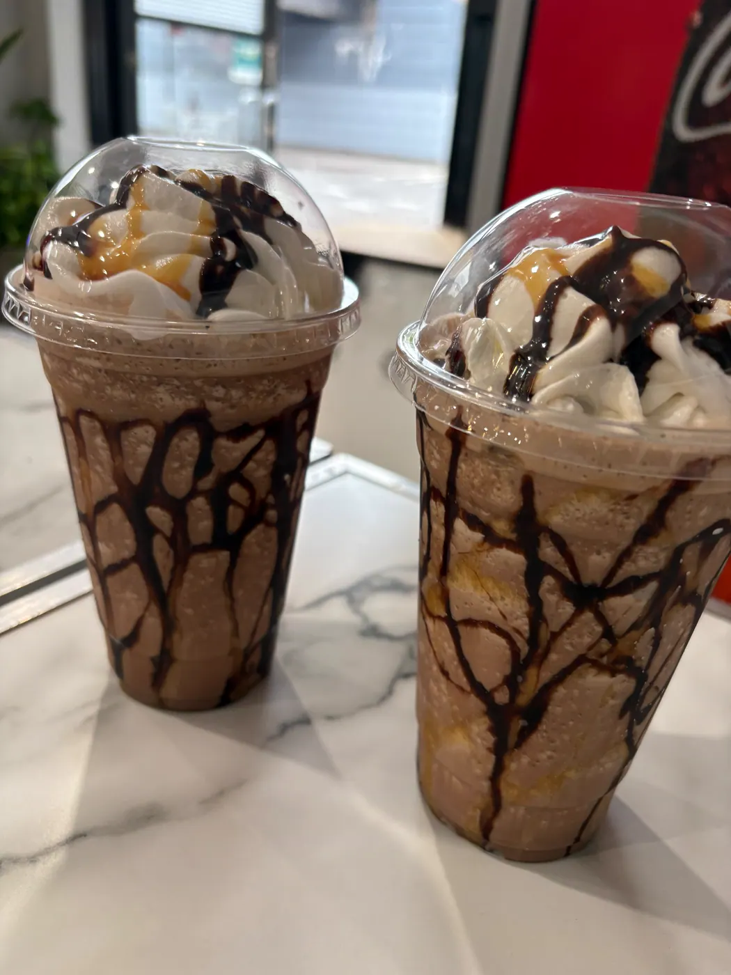 Two chocolate-topped frozen drinks at the cafe